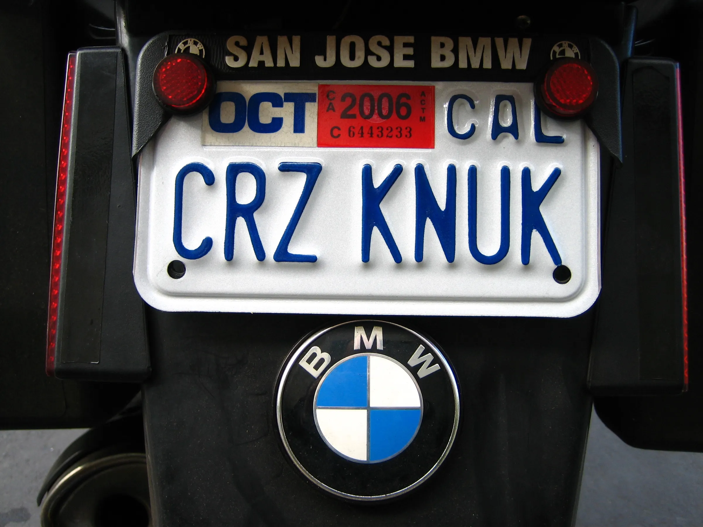 CRZ KNUK California license plate above the BMW roundel on the motorcycle