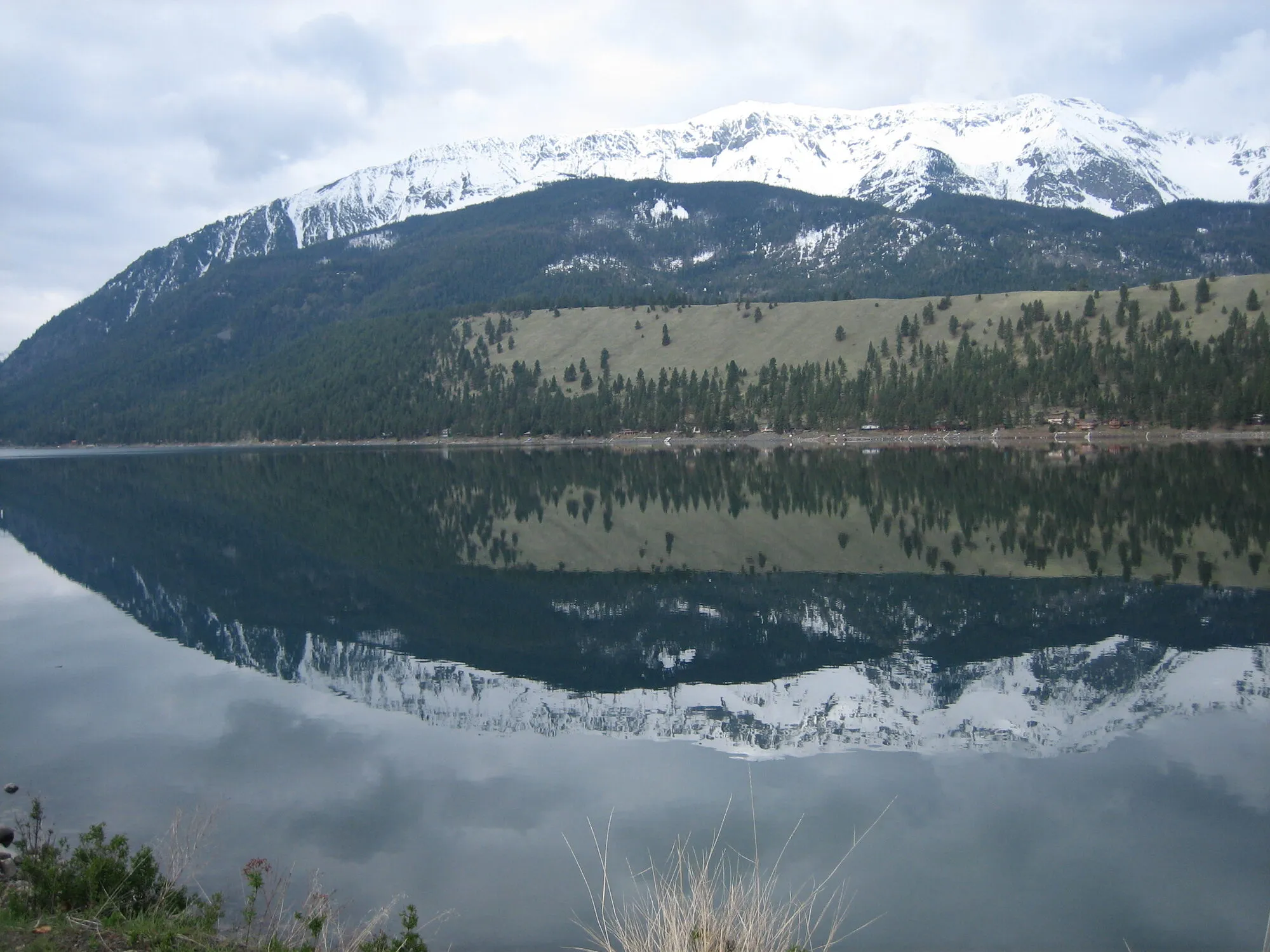 Snow-capped Wallowa Mountains reflected in a glassy lake